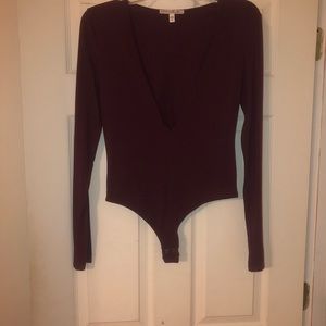 NWOT burgundy Express body suit. Size small